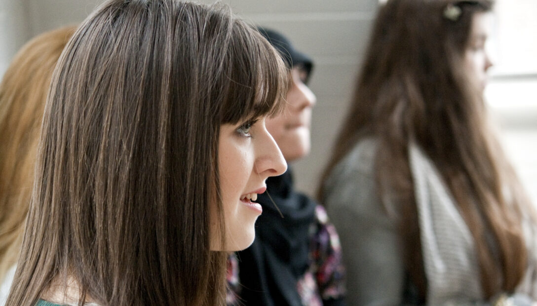 A young adult listening in a workshop