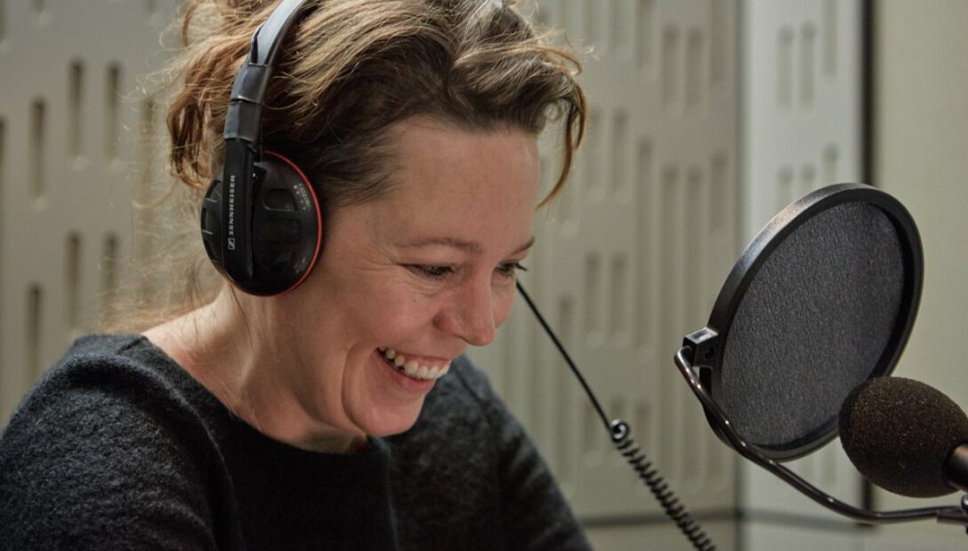 Olivia Colman at a microphone