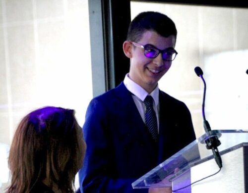 Student at St Philip's school at a lectern