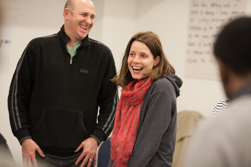Two people laughing at a workshop