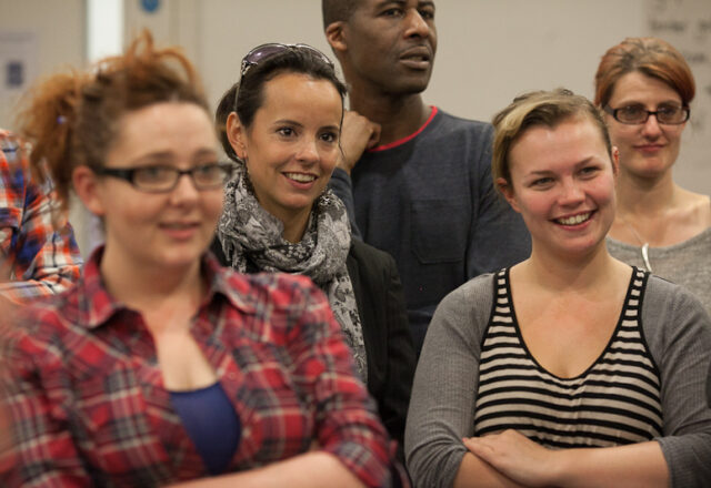 A group of workshop participants smiling